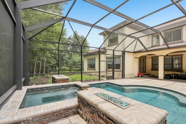 2645 Oakgrove Ave, Saint Augustine, FL 32092 - view of swimming pool featuring a patio, a lanai, and a pool with connected hot tub
