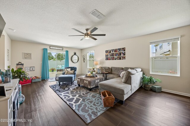 2069 Denton Trce, Green Cove Springs, FL 32043 - living room featuring a ceiling fan, dark wood-type flooring, and a textured ceiling