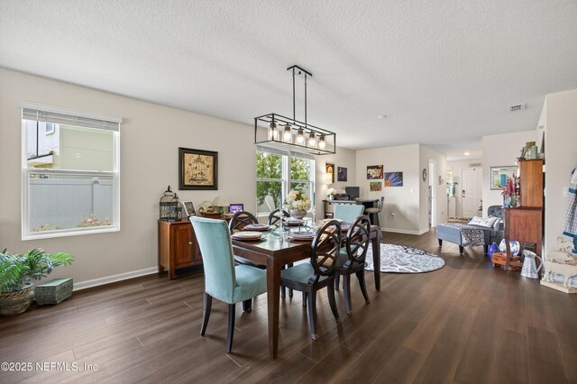 2069 Denton Trce, Green Cove Springs, FL 32043 - dining room featuring dark wood-style floors and a textured ceiling