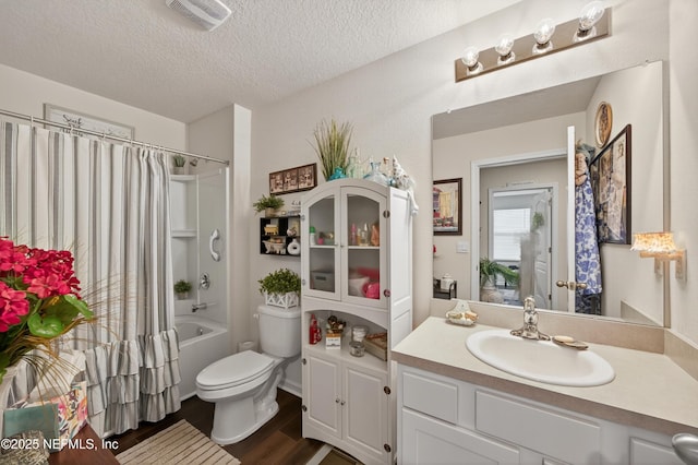 2069 Denton Trce, Green Cove Springs, FL 32043 - full bathroom with vanity, shower / bathtub combination with curtain, a textured ceiling, and wood finished floors