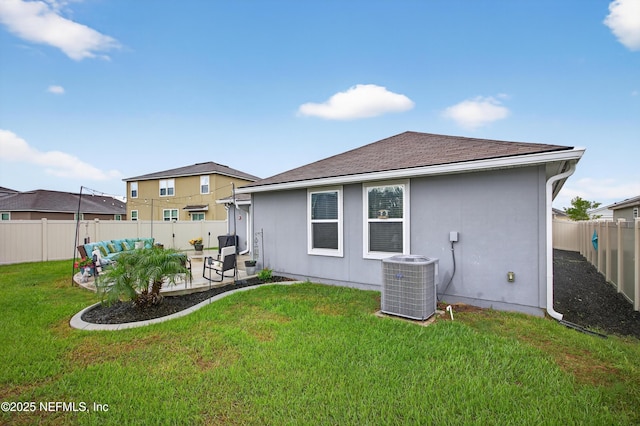2069 Denton Trce, Green Cove Springs, FL 32043 - rear view of house with an outdoor hangout area, a patio area, a fenced backyard, a shingled roof, and stucco siding