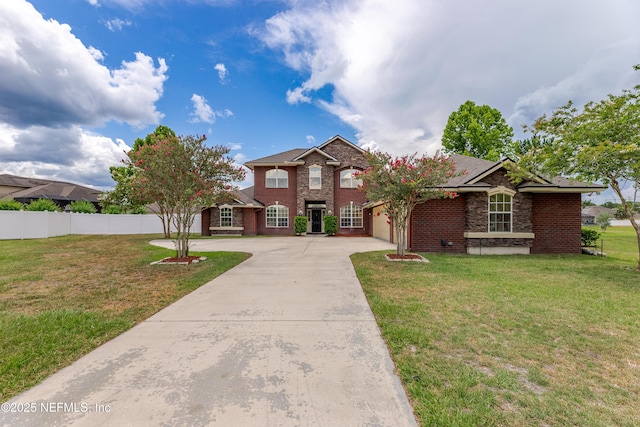 1300 Coopers Hawk Way, Middleburg, FL 32068 - traditional home with concrete driveway, an attached garage, and brick siding