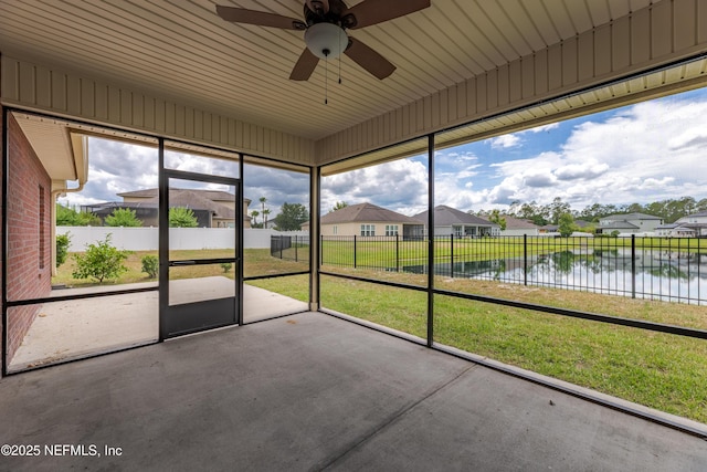 1300 Coopers Hawk Way, Middleburg, FL 32068 - unfurnished sunroom with a water view, a residential view, and ceiling fan