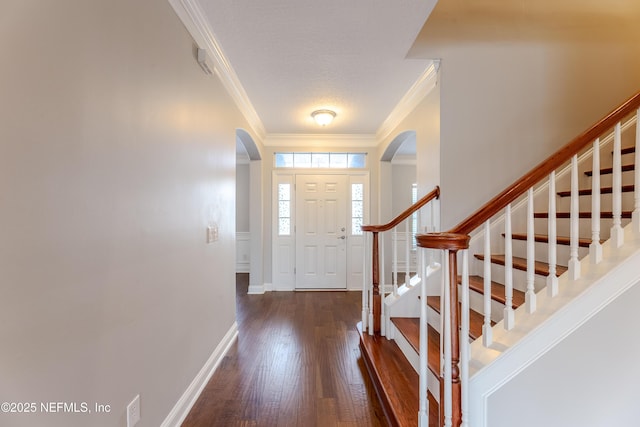 1300 Coopers Hawk Way, Middleburg, FL 32068 - entryway with crown molding, arched walkways, wood finished floors, and stairway