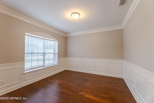 1300 Coopers Hawk Way, Middleburg, FL 32068 - unfurnished room featuring ornamental molding, wainscoting, a textured ceiling, and dark wood-style flooring