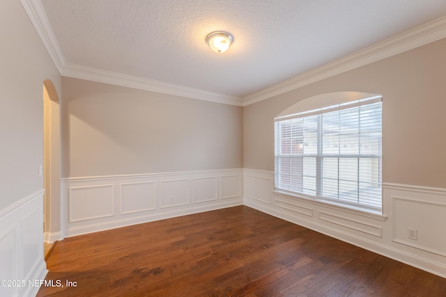 1300 Coopers Hawk Way, Middleburg, FL 32068 - spare room featuring crown molding, wainscoting, dark wood-style floors, and a decorative wall