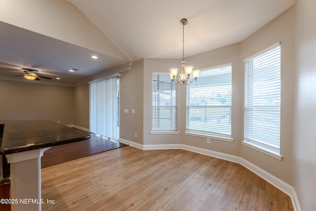1300 Coopers Hawk Way, Middleburg, FL 32068 - unfurnished dining area with a chandelier, light wood-style flooring, ceiling fan, vaulted ceiling, and recessed lighting