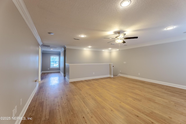 1300 Coopers Hawk Way, Middleburg, FL 32068 - spare room with ceiling fan, a textured ceiling, light wood finished floors, ornamental molding, and recessed lighting