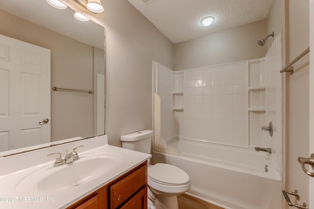 1300 Coopers Hawk Way, Middleburg, FL 32068 - bathroom with vanity, a textured ceiling, shower / washtub combination, and wood finished floors
