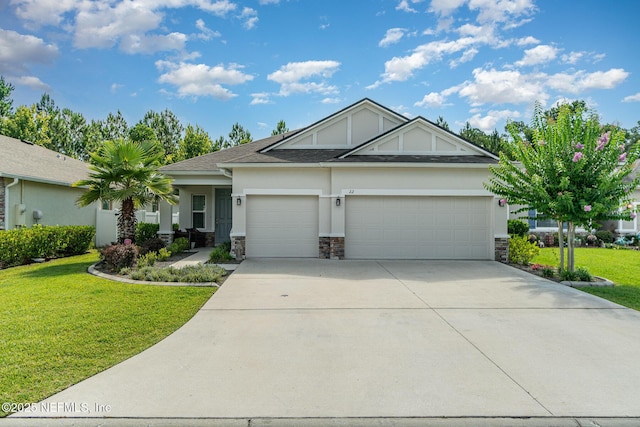 22 Sandstone Dr, Saint Augustine, FL 32086 - view of front of house featuring a garage, stucco siding, a front yard, concrete driveway, and stone siding