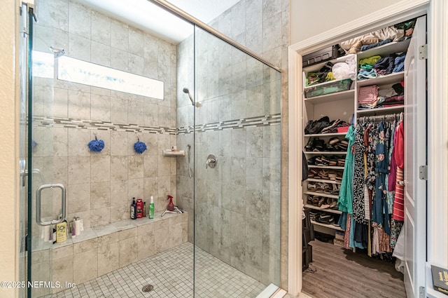 22 Sandstone Dr, Saint Augustine, FL 32086 - full bath featuring a shower stall, a walk in closet, and wood finished floors