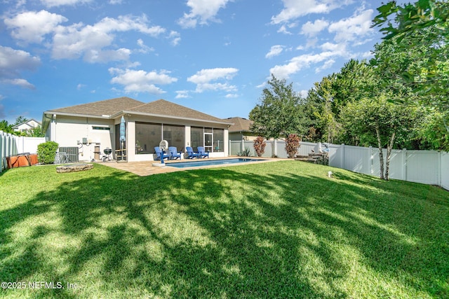 22 Sandstone Dr, Saint Augustine, FL 32086 - back of house featuring a sunroom, a fenced backyard, stucco siding, and a patio area