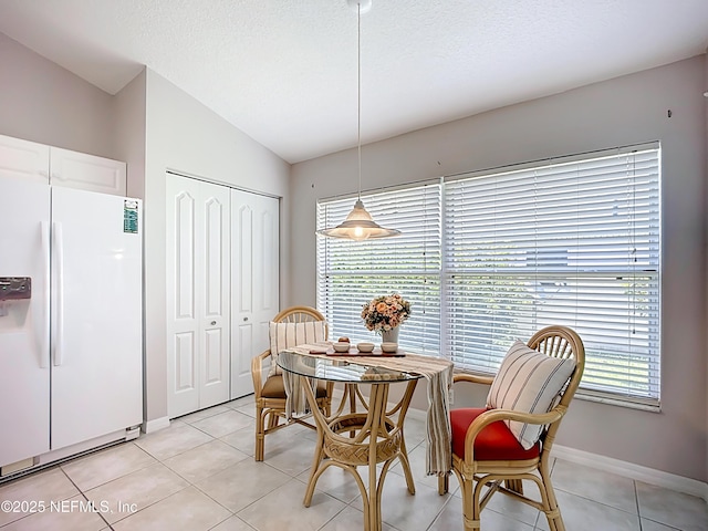 1300 Flagship Ct, Saint Augustine Beach, FL 32080 - dining space featuring lofted ceiling and light tile patterned floors