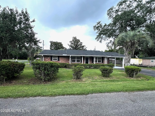 523 Eloise St, Macclenny, FL 32063 - ranch-style home featuring brick siding, driveway, and a carport