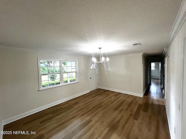 523 Eloise St, Macclenny, FL 32063 - spare room with a chandelier, dark wood finished floors, crown molding, and a textured ceiling