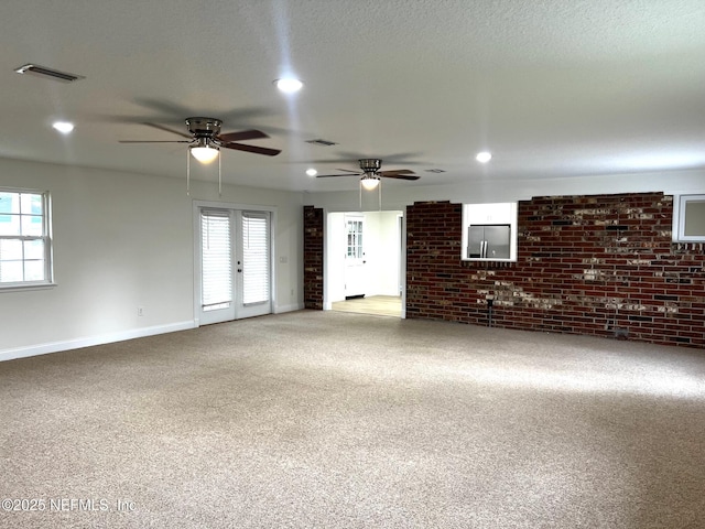 523 Eloise St, Macclenny, FL 32063 - unfurnished living room with brick wall, healthy amount of natural light, recessed lighting, carpet flooring, and a ceiling fan