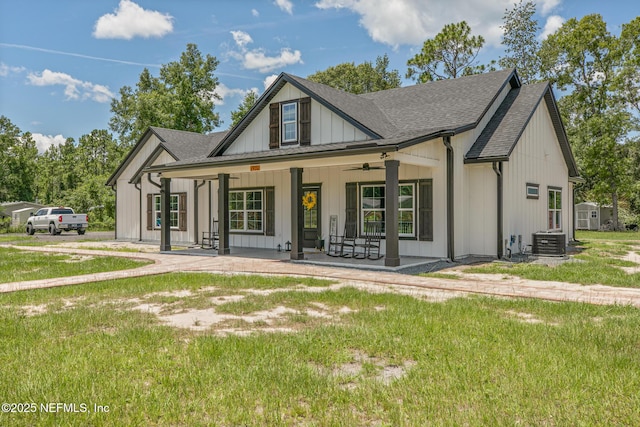 1926 Friendly Pl, Middleburg, FL 32068 - modern farmhouse style home with a porch, a front lawn, a shingled roof, and ceiling fan