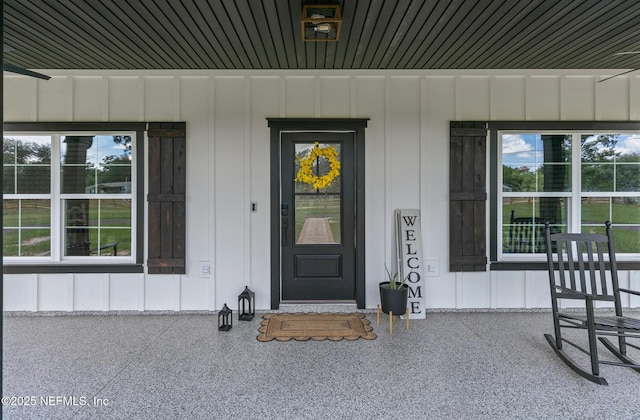 1926 Friendly Pl, Middleburg, FL 32068 - view of exterior entry featuring board and batten siding and a porch