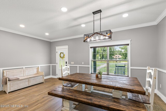 1926 Friendly Pl, Middleburg, FL 32068 - dining area featuring a chandelier, wood finished floors, ornamental molding, and recessed lighting