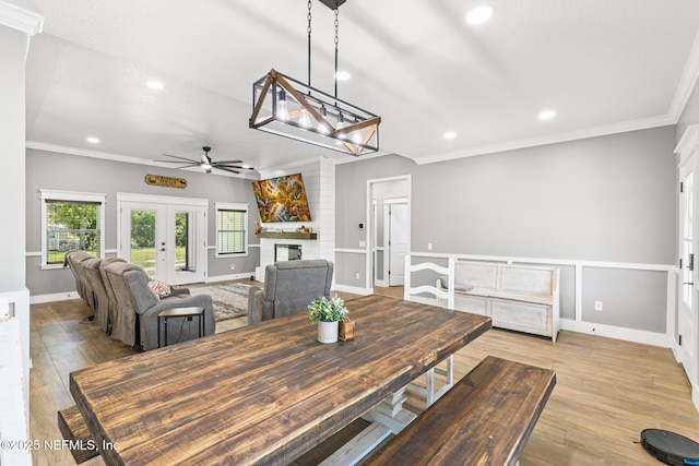 1926 Friendly Pl, Middleburg, FL 32068 - dining room featuring ceiling fan, crown molding, a fireplace, french doors, and recessed lighting