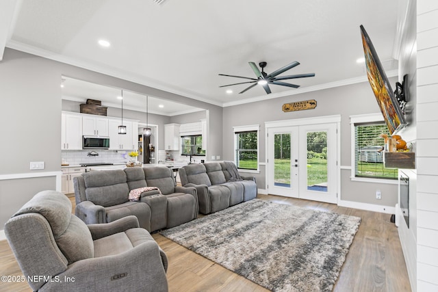 1926 Friendly Pl, Middleburg, FL 32068 - living room featuring ceiling fan, recessed lighting, crown molding, light wood-style floors, and french doors