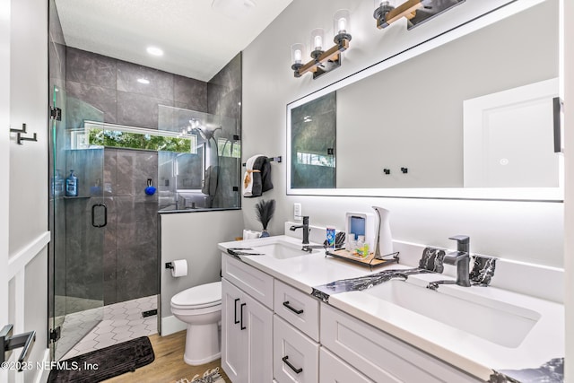 1926 Friendly Pl, Middleburg, FL 32068 - bathroom with double vanity, a stall shower, and wood finished floors