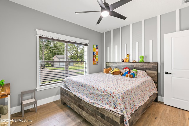 1926 Friendly Pl, Middleburg, FL 32068 - bedroom featuring wood finished floors and a ceiling fan