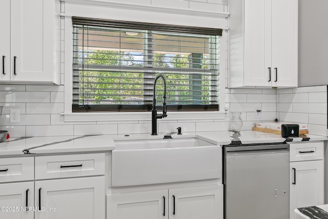 1926 Friendly Pl, Middleburg, FL 32068 - kitchen featuring backsplash, white cabinets, light countertops, and dishwashing machine