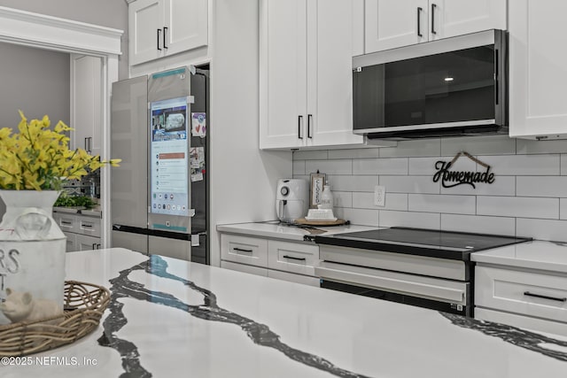 1926 Friendly Pl, Middleburg, FL 32068 - kitchen featuring stainless steel microwave, smart refrigerator, electric range oven, and decorative backsplash