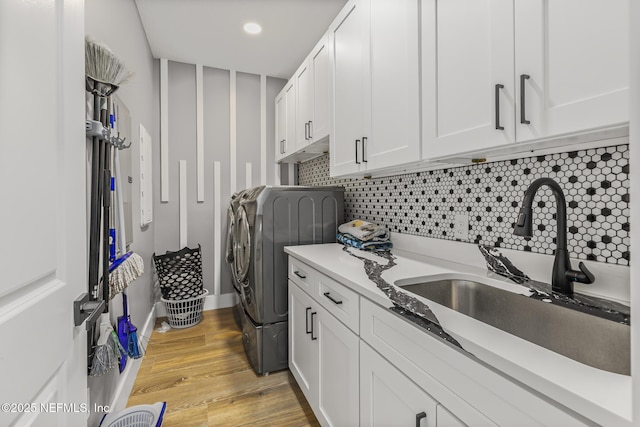 1926 Friendly Pl, Middleburg, FL 32068 - laundry room featuring washer and dryer, cabinet space, and light wood-style floors