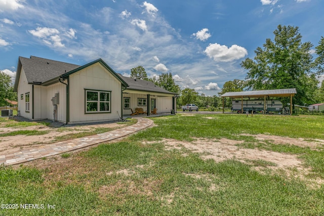 1926 Friendly Pl, Middleburg, FL 32068 - back of property featuring a yard, a carport, and a shingled roof