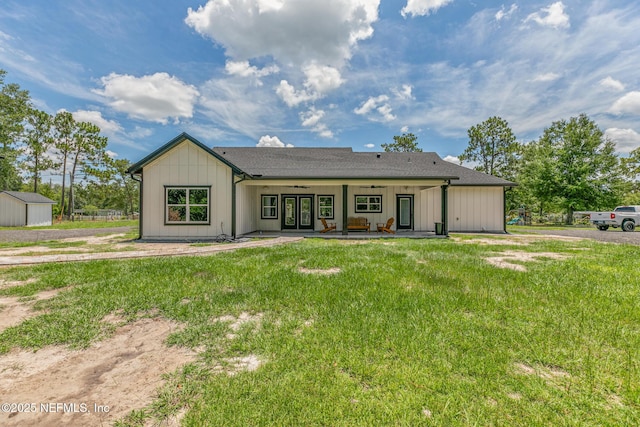 1926 Friendly Pl, Middleburg, FL 32068 - rear view of house featuring french doors, ceiling fan, a lawn, a patio area, and board and batten siding