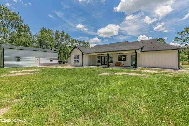 1926 Friendly Pl, Middleburg, FL 32068 - back of property with a lawn, board and batten siding, a patio, ceiling fan, and roof with shingles