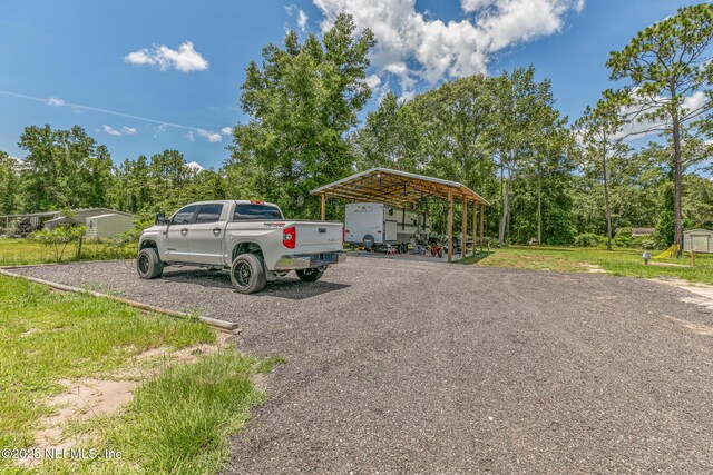 1926 Friendly Pl, Middleburg, FL 32068 - exterior space featuring a carport and gravel driveway