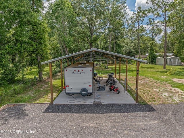 1926 Friendly Pl, Middleburg, FL 32068 - view of parking with a detached carport and a storage shed