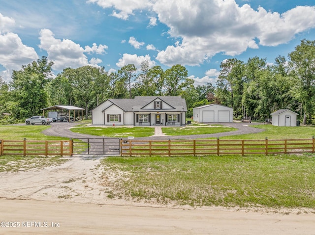 1926 Friendly Pl, Middleburg, FL 32068 - view of front of house with a gate, an outbuilding, a garage, a carport, and driveway
