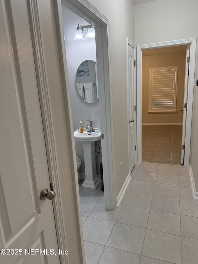 30139 Trophy Trl, Bryceville, FL 32009 - hall with light tile patterned floors and a sink