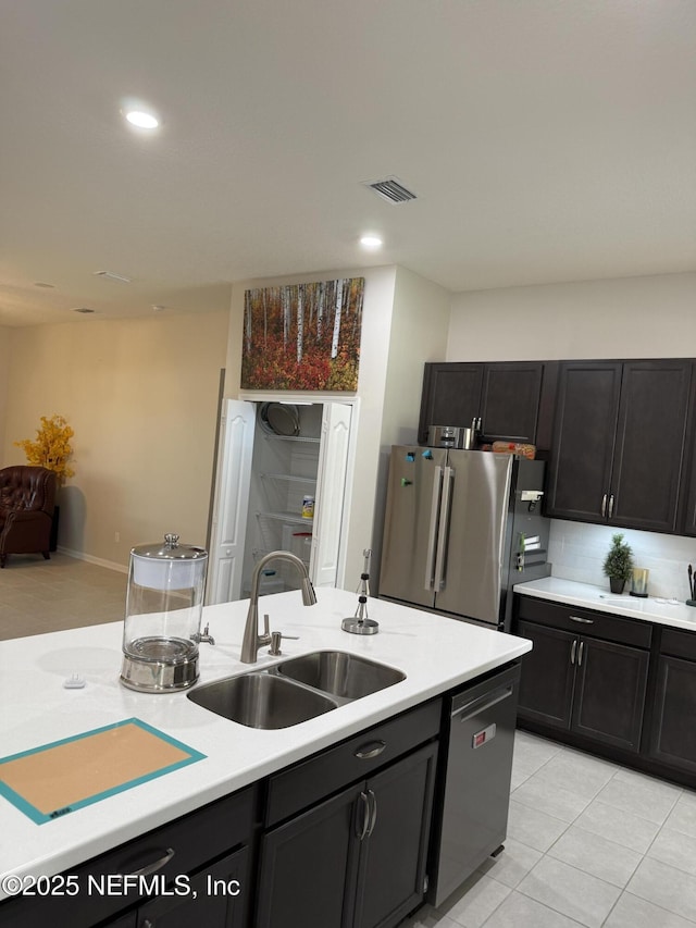 30139 Trophy Trl, Bryceville, FL 32009 - kitchen featuring appliances with stainless steel finishes, light countertops, light tile patterned floors, recessed lighting, and decorative backsplash