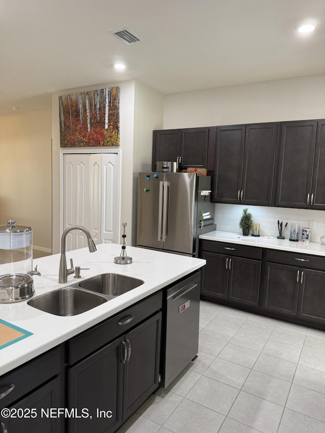 30139 Trophy Trl, Bryceville, FL 32009 - kitchen featuring appliances with stainless steel finishes, light countertops, light tile patterned floors, decorative backsplash, and recessed lighting
