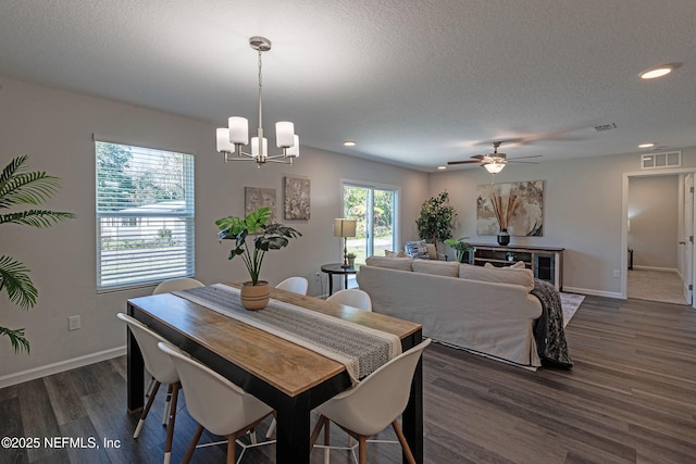 3138 Phyllis St, Jacksonville, FL 32205 - dining area featuring dark wood-type flooring, recessed lighting, a chandelier, a ceiling fan, and a textured ceiling