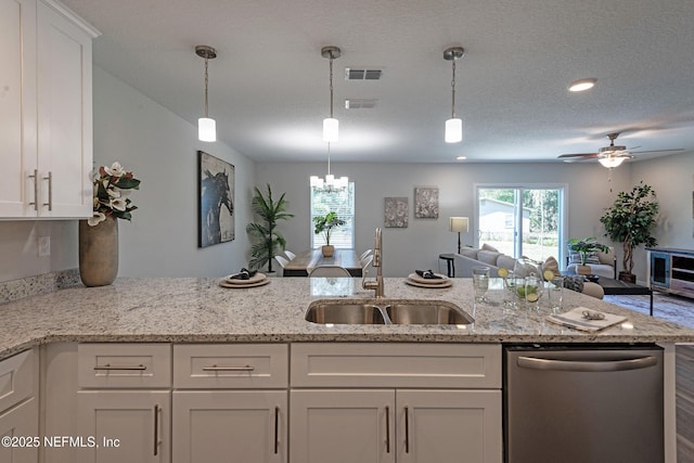 3138 Phyllis St, Jacksonville, FL 32205 - kitchen with dishwasher, white cabinetry, open floor plan, and a ceiling fan