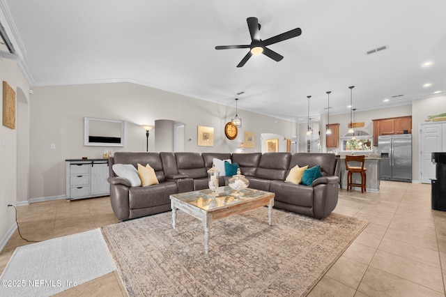 338 Deerfield Glen Dr, Saint Augustine, FL 32086 - living room with arched walkways, crown molding, a ceiling fan, light tile patterned floors, and recessed lighting