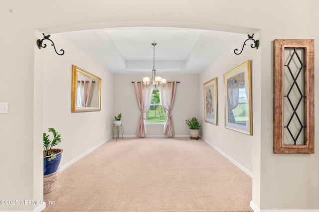 338 Deerfield Glen Dr, Saint Augustine, FL 32086 - unfurnished room with a chandelier, carpet flooring, and a tray ceiling