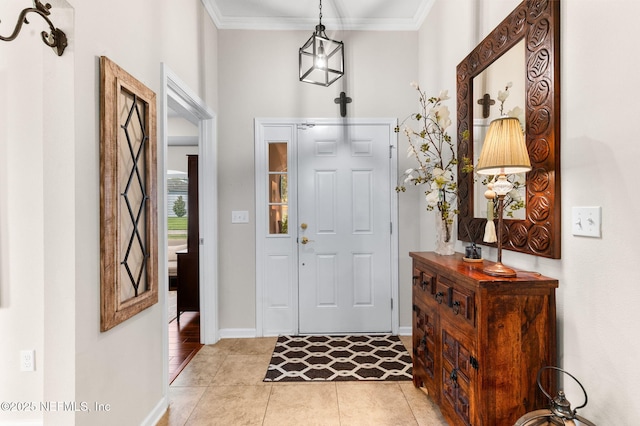 338 Deerfield Glen Dr, Saint Augustine, FL 32086 - foyer entrance with ornamental molding and light tile patterned flooring