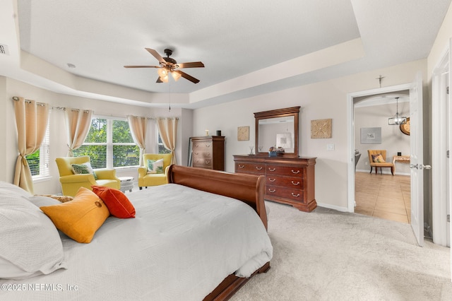 338 Deerfield Glen Dr, Saint Augustine, FL 32086 - bedroom with a raised ceiling, light colored carpet, and a ceiling fan