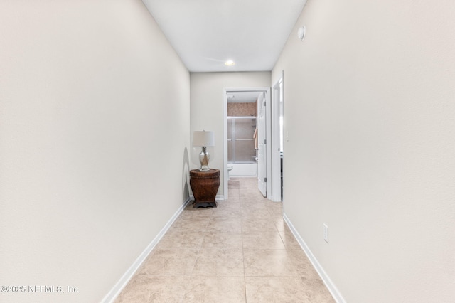 338 Deerfield Glen Dr, Saint Augustine, FL 32086 - hallway featuring baseboards and light tile patterned floors