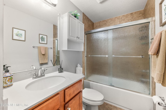 338 Deerfield Glen Dr, Saint Augustine, FL 32086 - full bath with vanity, shower / bath combination with glass door, and a textured ceiling