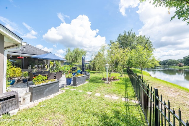 338 Deerfield Glen Dr, Saint Augustine, FL 32086 - fenced backyard featuring a water view, a vegetable garden, and a patio