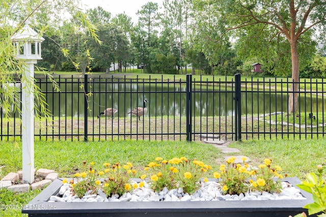 338 Deerfield Glen Dr, Saint Augustine, FL 32086 - gate with a water view and view of wooded area