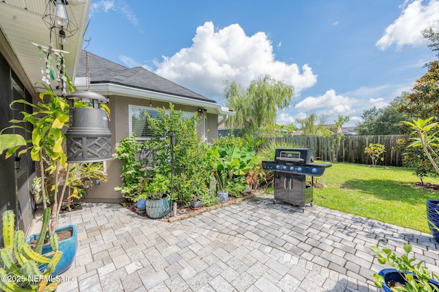 338 Deerfield Glen Dr, Saint Augustine, FL 32086 - fenced backyard with grilling area and a patio